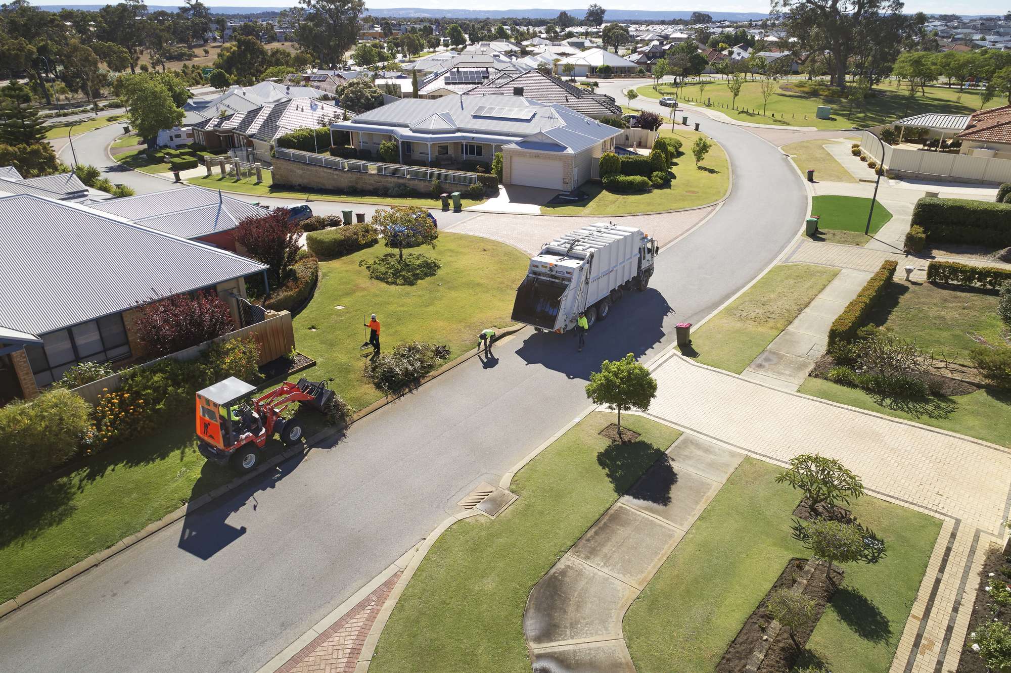 Aerial view of a D&M Waste Management crew collecting green waste from residential verges